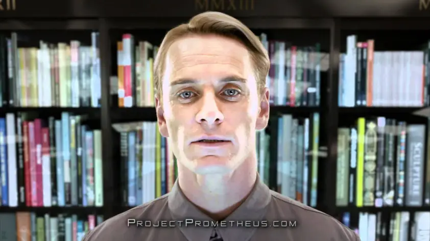 David em frente a uma estante com muitos livros em Prometheus.